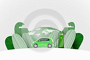 Green electric car charging at the charger station on the street with green earth in the background. Sustainable energy and