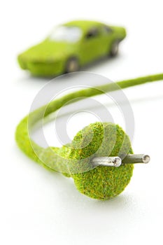 Green electric plug with eco car icon