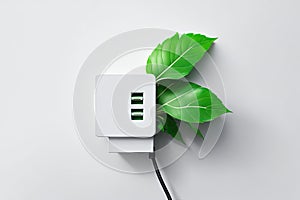Green electric power socket with fresh leaves. ai generative
