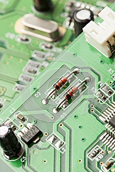 Green Electrical Circuit Board with microchips and transistors