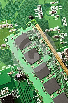 Green Electrical Circuit Board with microchips and transistors