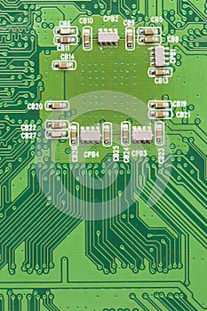 Green Electrical Circuit Board with microchips and transistors