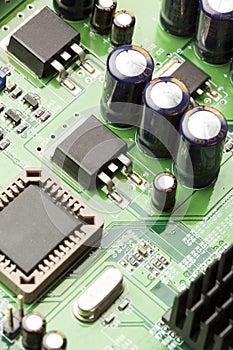 Green Electrical Circuit Board with microchips and transistors