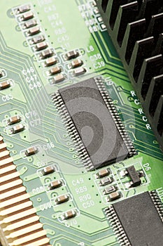 Green Electrical Circuit Board with microchips and transistors