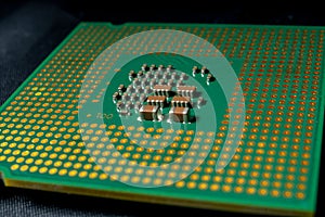 Green electronic chip CPU closeup. Concept of high technology and repair microchip