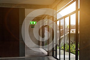 Green emergency exit sign and label no smoke in rest corner showing the way to escape and caution safety awareness