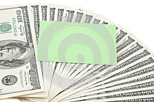 Green empty card on a spread of cash