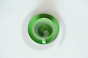 Green empty cup, isolated. View above