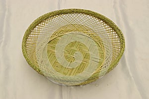 Green empty handmade bamboo basket isolated. Bread storage container