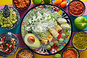 Green enchiladas Mexican food with guacamole photo