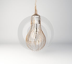 Green energy concept with lightbulb and grass