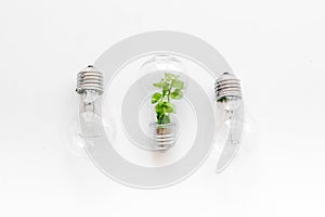 Green energy eco concept with grass in bulb, top view