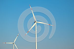 Green energy.Wind generator .Natural energy.Windmill on sky background. renewable energy.Environmentally friendly