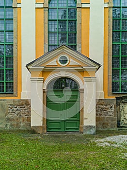 Green entrance doors to old big building