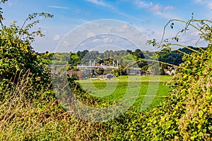 Green esplanade, suspension bridge and Kanne village