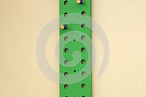 Green exercise peg board with  pegs