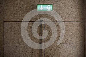 Green exit sign above a door