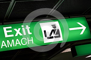 Green Exit sign in airport