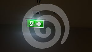 Green exit sign in the office building