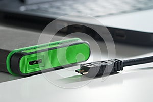 Green external hard disk with mini usb cable