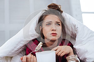 Green-eyed woman watching dramatic film