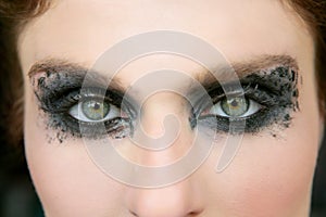 Green eyes woman, black makeup eye shadow