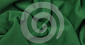 Green fabric. Cloth background. Green cloth waves background texture.