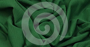 Green fabric. Cloth. Green cloth waves background texture.