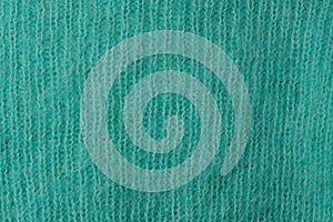 green fabric texture from a piece of wool