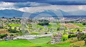 Green Farm Land field and Kathmandu city in the backdrop on a cloudy day