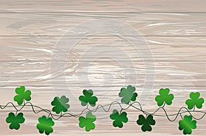 Green festive bunting with clover. Irish holiday - Happy St. Patrick`s Day with garland of three-leaf. Greeting card, poster,