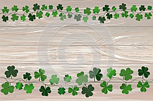 Green festive bunting with clover. Irish holiday - Happy St. Patrick`s Day with garland of three-leaf. Greeting card, poster,