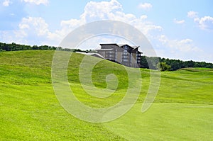 Green field and blue sky background, copy space