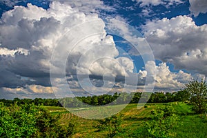 Green field and clouds