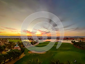 Green Field with the Colorful Sky at Sunset - Showing the amazing colors of the sky at the sunset