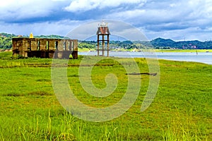 Green field and old belltower