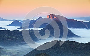 Green field and view of Trzy Korony in Pieniny Mountains, Poland