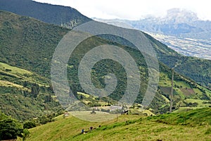 Green fields above a valley