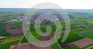Green fields around a small town. Beautiful European landscape. Small European city aerial view. german village aerial