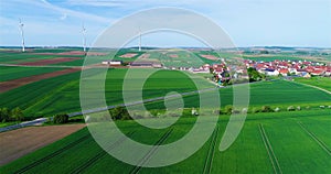 Green fields around a small town. Beautiful European landscape. Small European city aerial view. german village aerial