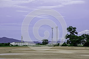 Green fields with modern factory buidling for green industry concept photo