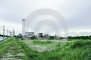 Green fields with modern factory buidling for green industry concept photo