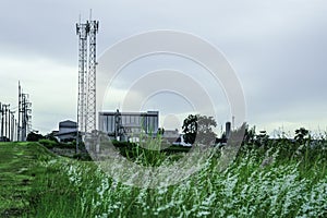 Green fields with modern factory buidling for green industry concept photo