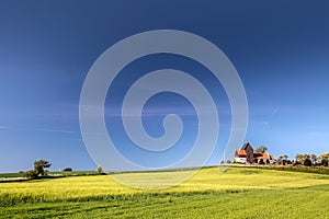 Green fields by the Ruts Kirke church on Bornholm