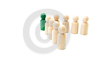 Green figure leading group of wooden figures in spearhead formation, isolated on white background