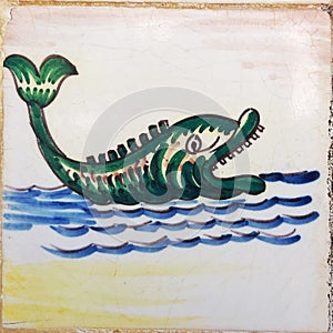 Green fish monster antique tile