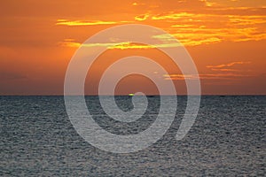 Green flash of the sun in the Blue Lagoon Beach in Nacula Island, Yasawa, Fiji