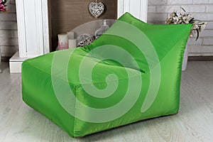 Green flexible and adjustable seat beanbag in the interior