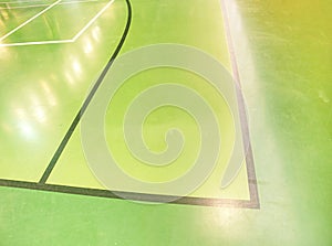 Green floor in school gym in details. Court of Club with lines