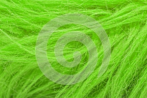 Green fluffy wool texture, animal wool background, painted fur texture closeup